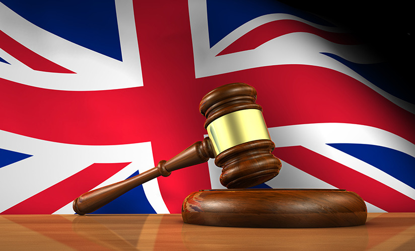Remote Work Laws in the UK: A Gavel in front of the union jack.